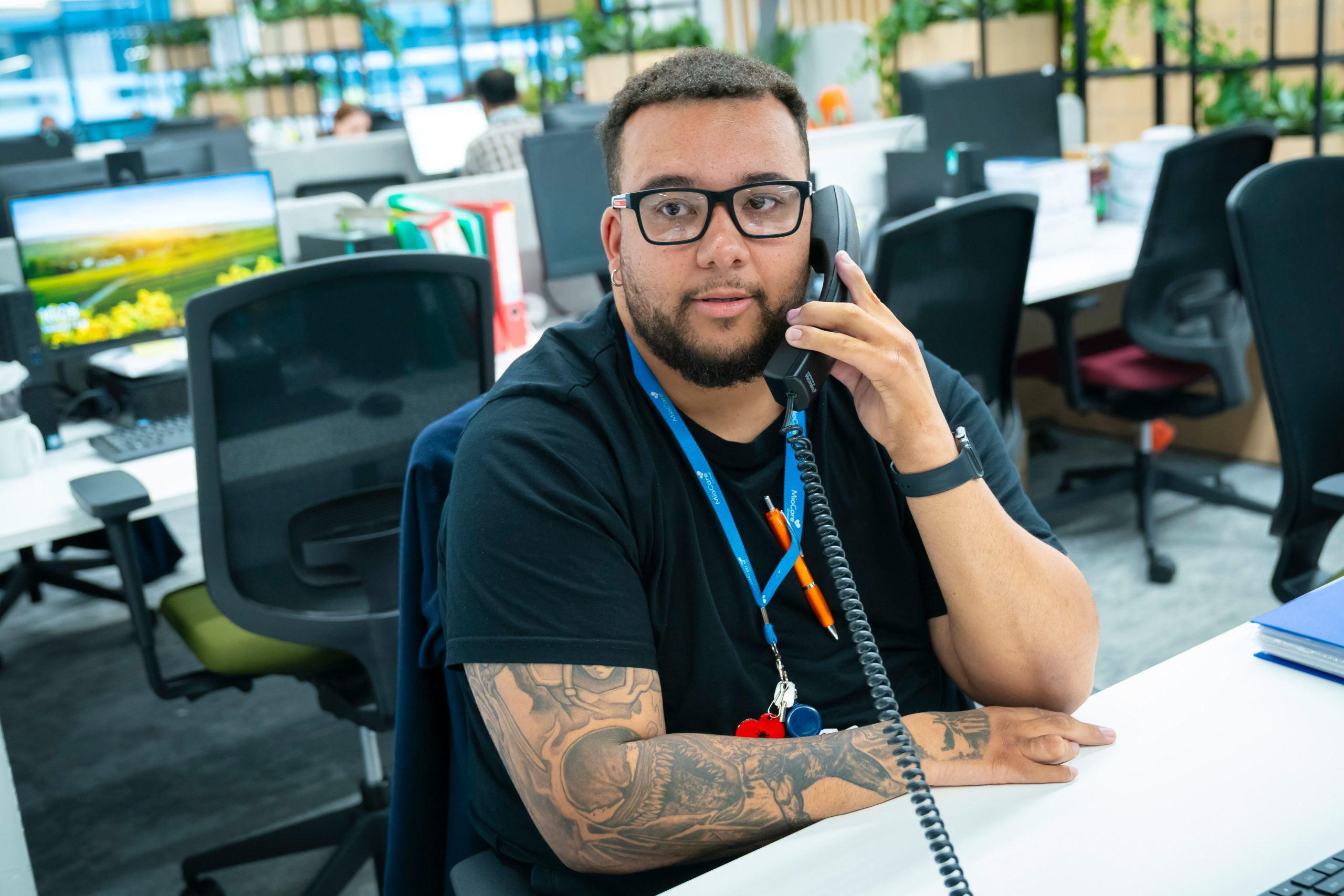 MioCare employee on phone